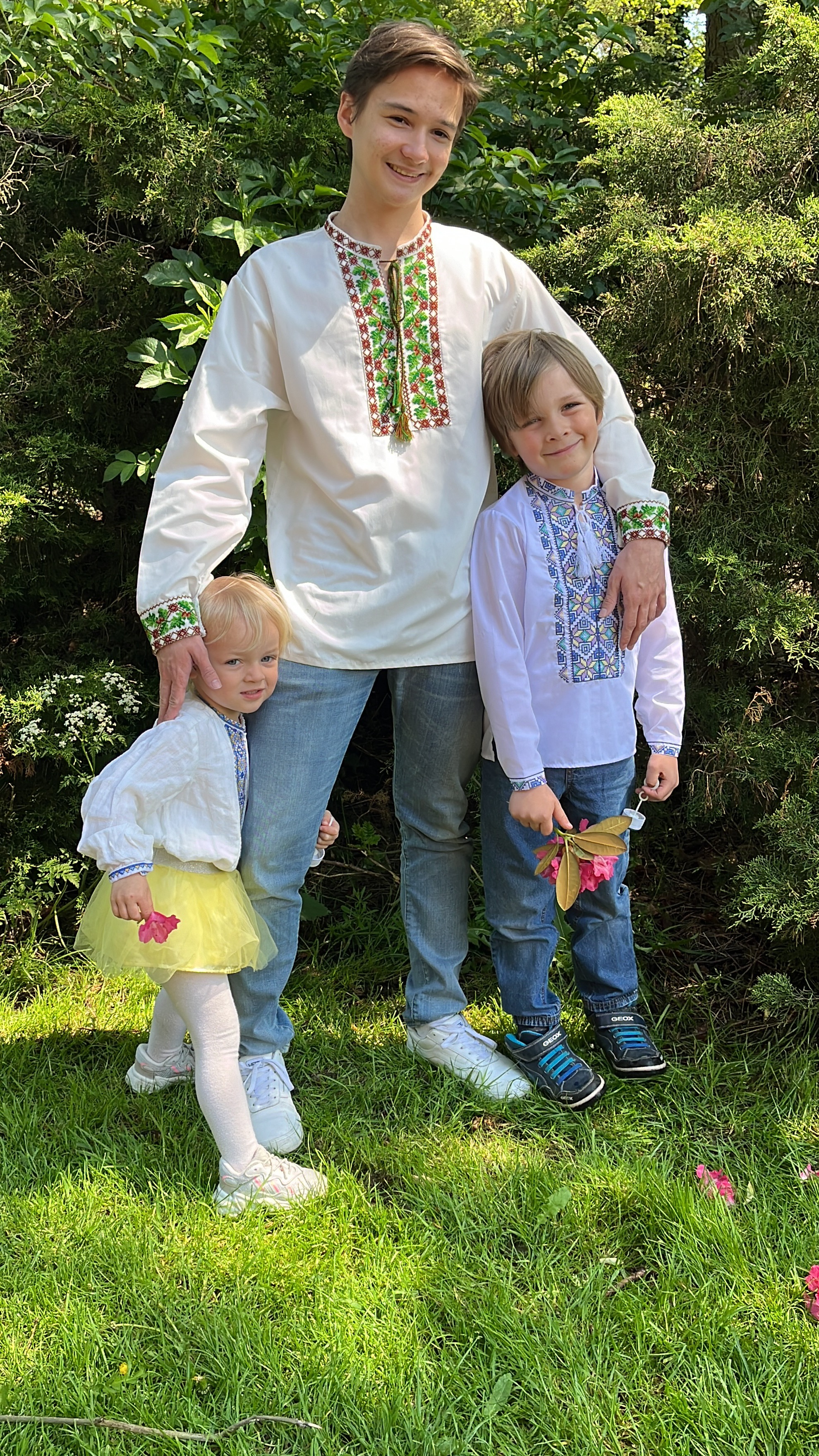 Founder Yevhenii Butov with his family in a park in Amsterdam